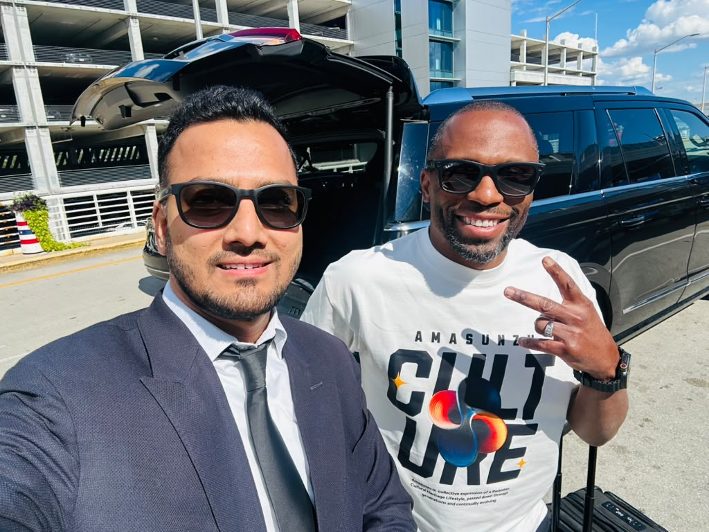 Chauffeur with a client at the airport parking garage